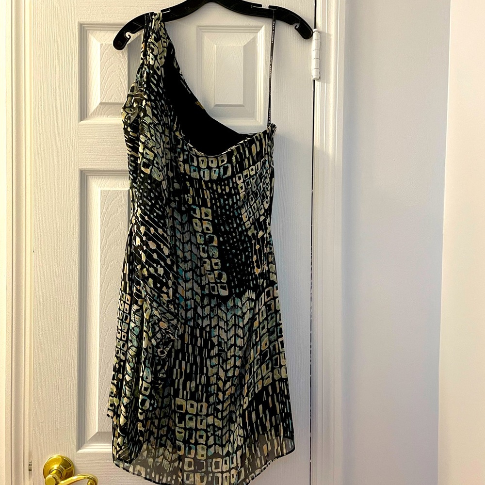 Off the shoulder, one side dress. Sleeve can be worn on either side